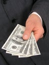 BusinessmanÃ¢â¬â¢s Hand Offering Money Royalty Free Stock Photo